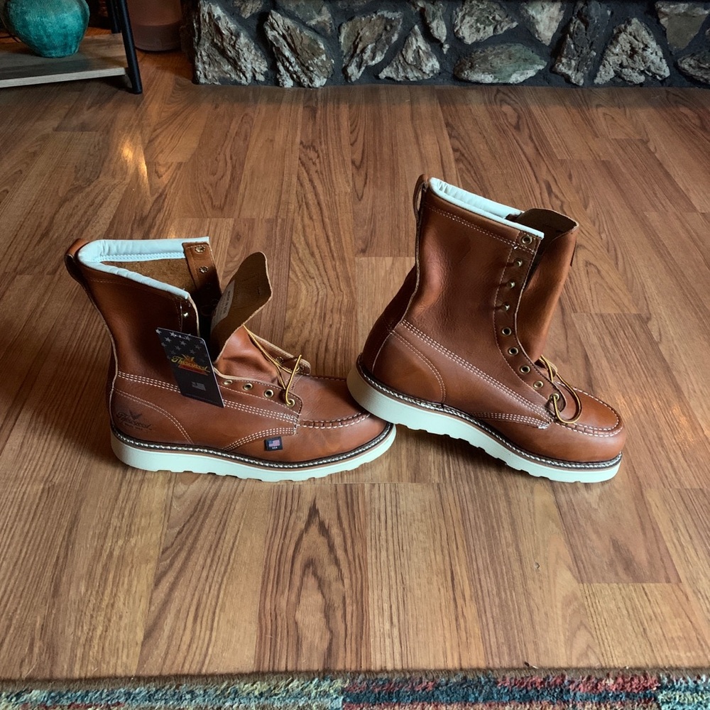 Brown leather Men’s Steel toe.  Moc 8” wedge sole.